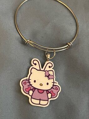 Hello Kitty Silver-Tone Bangle Bracelet with Pink & Purple Butterfly Charm